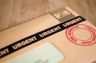 time barred debt brown envelope with urgent on it